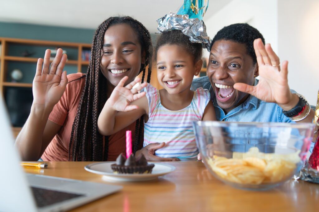 portrait-family-celebrating-birthday-online-video-call-while-staying-home